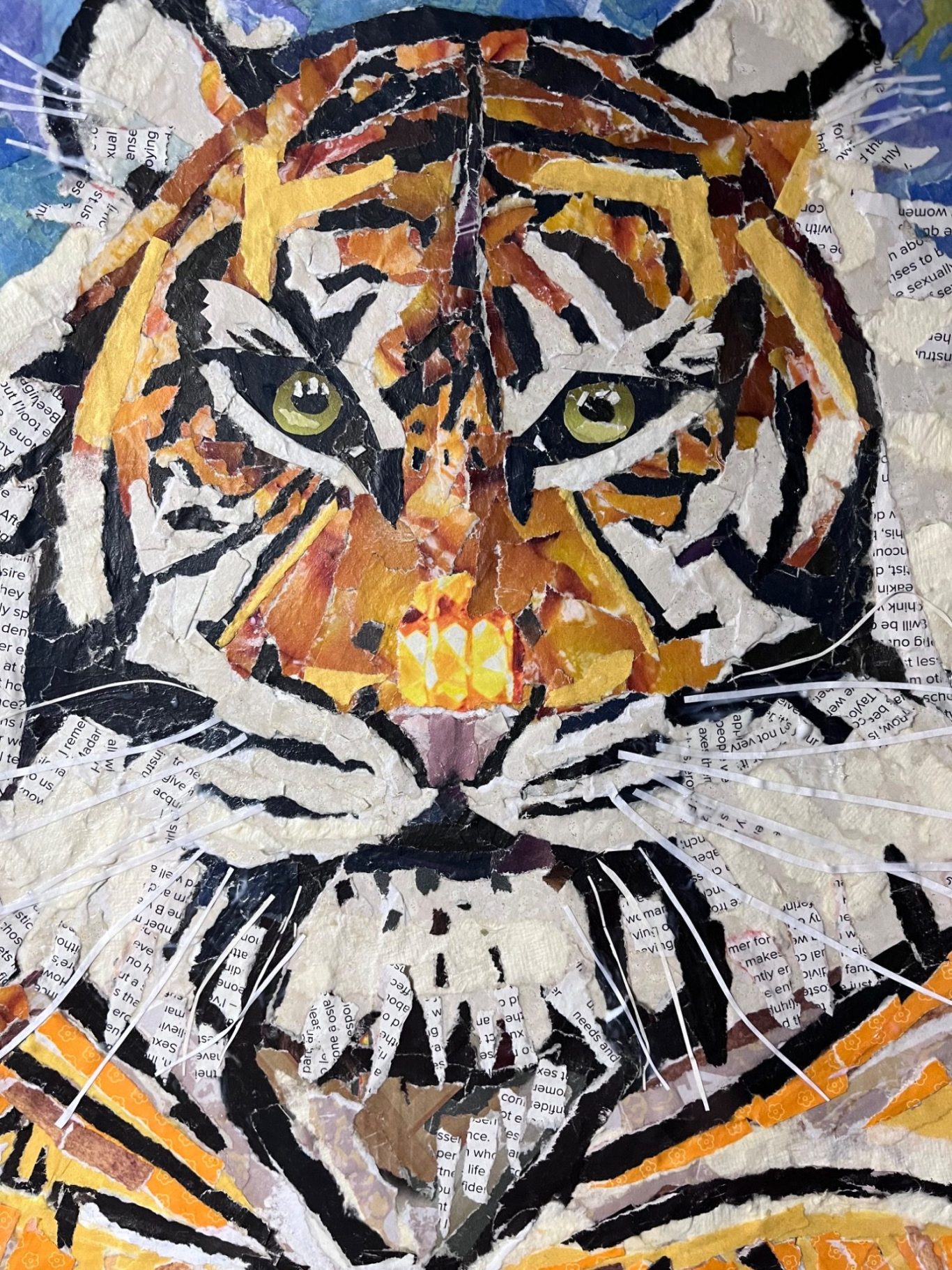 Mosaic artwork of a tiger's face with vivid colours and intricate details.